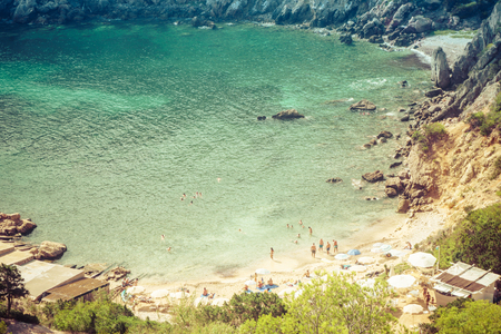 Ibiza, Spain, August 27, 2017: Ibiza natural beach view with some tourists during summer.の写真素材