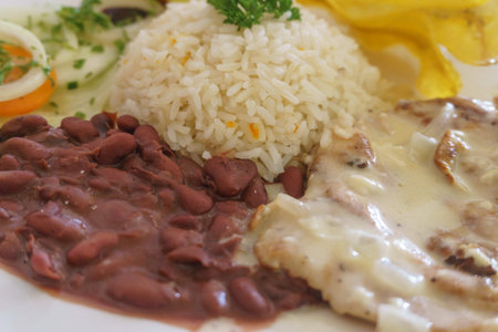 typical lunch of meat ,beans, plantains and rice in Nicaraguaの写真素材