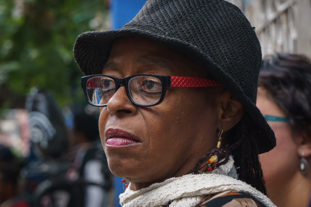 La Havana, Cuba, January 08, 2017: black woman with black hat and glasses, street portrait, editorial captionのeditorial素材