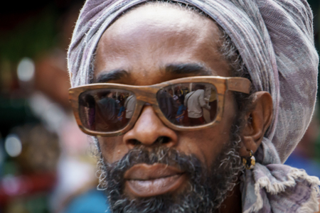 La Havana, Cuba, January 08, 2017:  Portrait of a black cuban man with sunglasses on street from la Havana. Afrocaribbean rasta cultureのeditorial素材