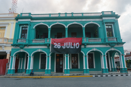 Santa Clara, Cuba, January 5, 2017: Official Building with flag of 26 july, party of Fidel Castroのeditorial素材