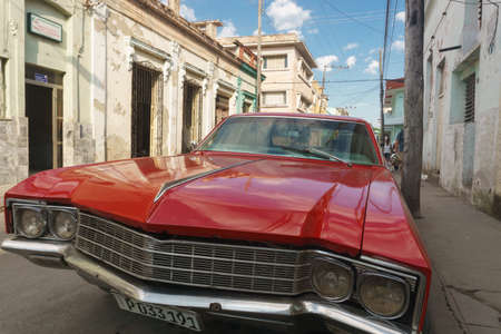 Santa Clara, Cuba, January 5, 2017: Red car on street. Typical cuban travel imagery picture. Old red car from Cubaのeditorial素材