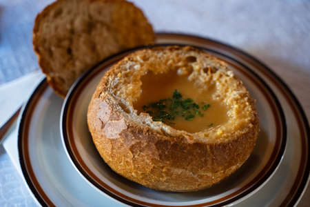 Typical Madeiran dish made by stuffed bread with fish sauceの写真素材