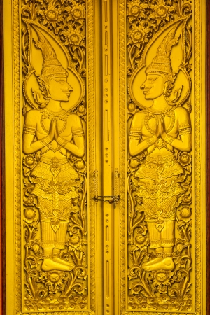 gold door of temple at thailandの写真素材