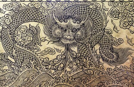 Gold dragon on the door of thai temple bangkokの写真素材