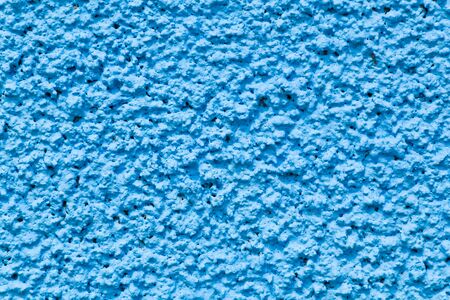 The texture of shaking cement to the wall and  painting blue colorの写真素材