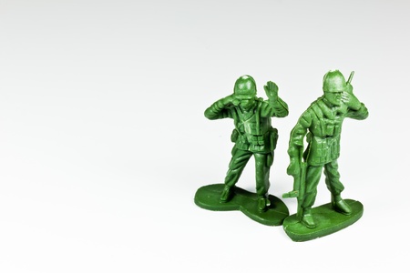 The isolated image of two green plastic toy soldiersの写真素材