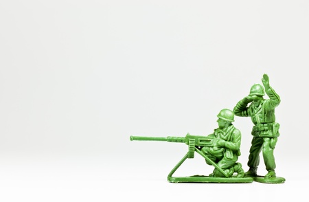 The isolated image of two green plastic toy soldiersの写真素材