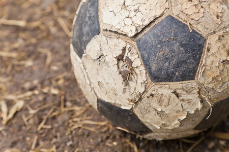 The closeup image of an old ball on the groundの写真素材