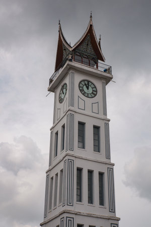 big clock in the middle of the square with a cloudy skyの写真素材
