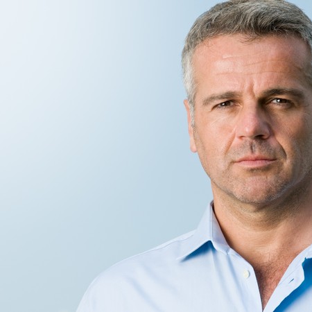 Close up portrait of serious mature businessman outdoorの写真素材