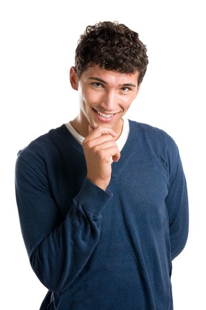 Happy smiling latin man looking at camera with satisfaction isolated on whiteの写真素材