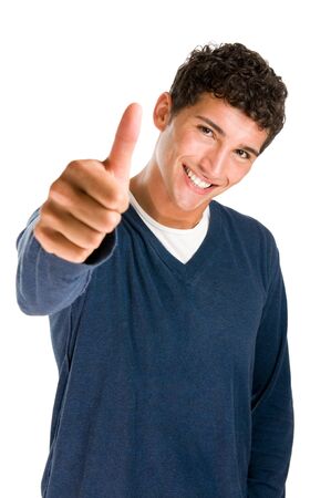 Happy casual young man showing thumb up and smiling isolated on white backgroundの写真素材