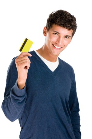 Happy smiling young man showing credit card isolated on white backgroundの写真素材