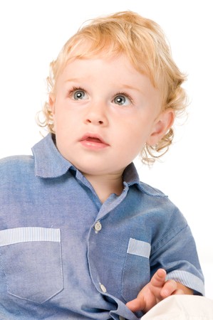 Beautiful astonished little boy looking uo isolated on white backgroundの写真素材