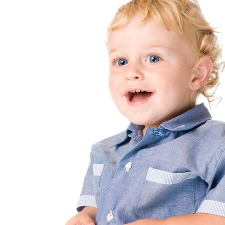 Beautiful happy little boy laughing and looking away isolated on white backgroundの写真素材