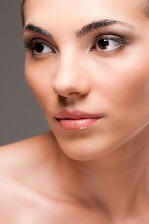 Close up beauty portrait of young beautiful woman with perfect skin and makeupの写真素材