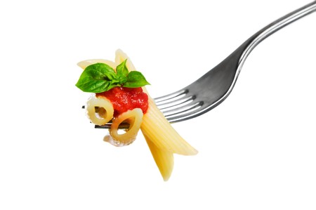 Macaroni pasta with tomato and basil on fork isolated on white background. Fine Italian food. Professional studio imageの写真素材
