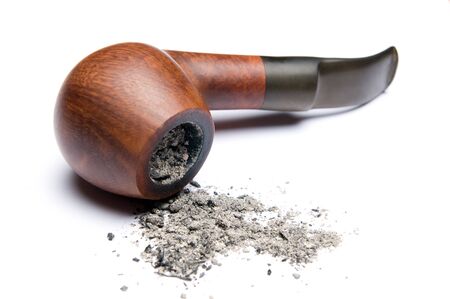 Classic brair pipe with tobacco ashes isolated on white backgroundの写真素材