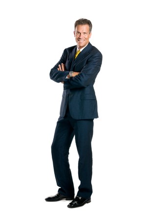 Smiling mature businessman standing full length isolated on white backgroundの写真素材