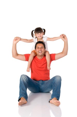 Smiling father carrying on his shoulders his little daughter isolated on white backgroundの写真素材