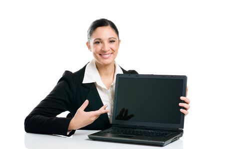 Young business woman showing blank laptop screen ready for your text and promotion, isolated on white background.の写真素材