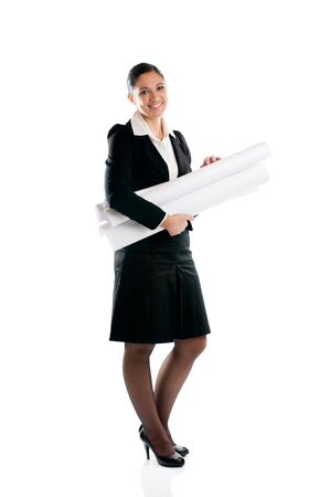 Full length young architect woman with plans isolated on white backgroundの写真素材