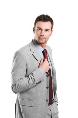 Professional young businessman looking at camera with confidence isolated on white backgroundの写真素材