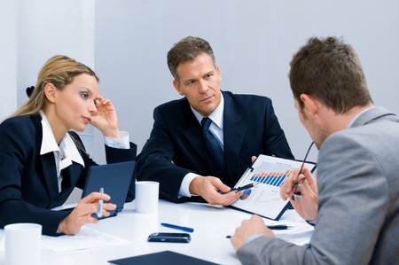 Business team working and discussing together their business plan at meeting in officeの写真素材