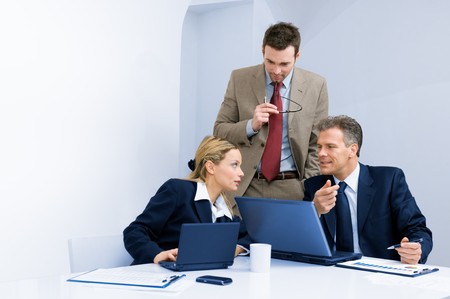 Modern business team discussing together their business strategy at meeting in officeの写真素材