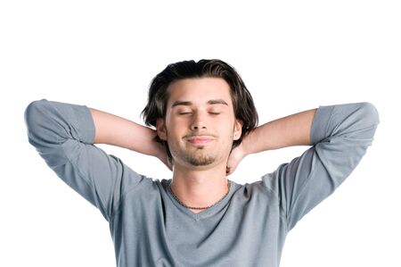 Young latin man taking a break and relaxing with closed eyes isolated on white backgroundの写真素材