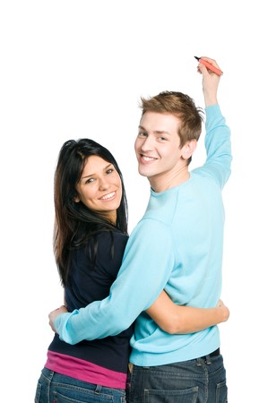 Happy young couple writing on white board with space for your text, isolated on white backgroundの写真素材