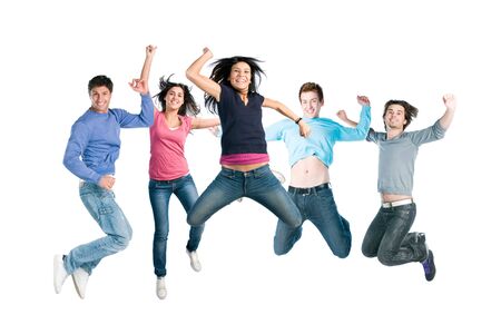 Happy active group of young friends jump together with fun isolated on white backgroundの写真素材