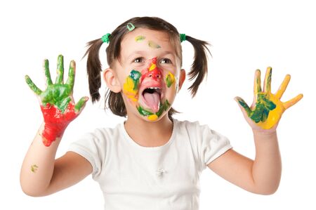 Happy little playing and painting with colors isolated on white backgroundの写真素材
