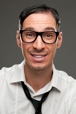 Funny portrait of happy nerd with naive expressionの写真素材