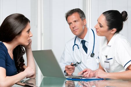 Young female patient discuss with doctors on her medical exam at hospitalの写真素材
