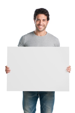 Happy young man showing and displaying placard ready for your text or product Happy young man showing and displaying placard ready for your text or product