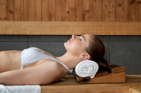 Closeup of beautiful lady relaxing at sauna in a spa centerの写真素材