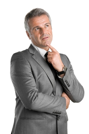 Pensive businessman looking up with pensive expression isolated on white background Pensive businessman looking up with pensive expression isolated on white background