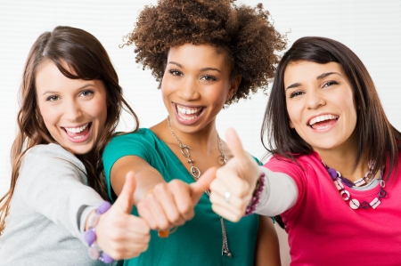 Group Of Happy Young Friends Showing Thumb Up Sign
の写真素材