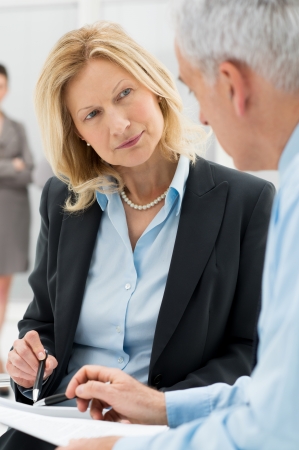 Close Up Business People Discussing Working Together In Officeの写真素材
