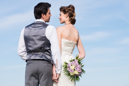 Portrait Of Young Married Couple Holding Handの写真素材