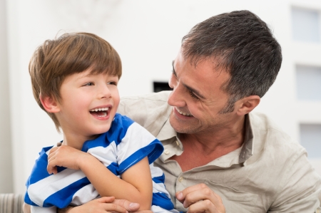 Happy Father And Son Playing With Each Otherの写真素材