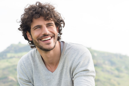 Portrait Of Young Handsome Man Smiling Outdoorの写真素材