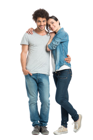 Portrait Of Happy Young Loving Couple Looking At Camera Isolated On White Background