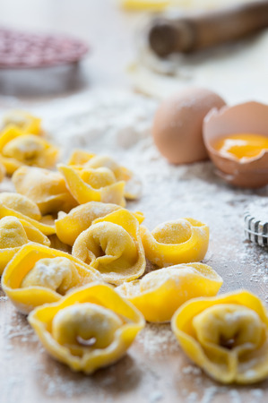 Handmade tortellini on cutting boardの写真素材