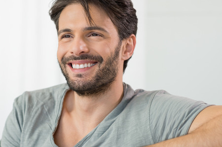 Closeup of smiling man looking awayの写真素材