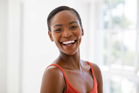 Portrait of beautiful african woman smiling and looking at camera.の写真素材
