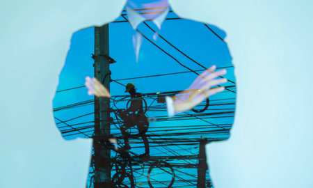 Double exposure engineer checking the cableの写真素材