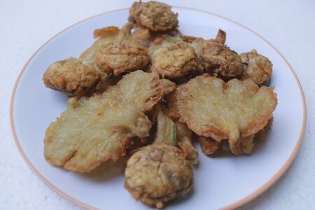 Jamur Goreng Krispi.Deep fried crispy mushroom. made from champignon, and oyster mushroom with flour, Isolated on with background.の写真素材